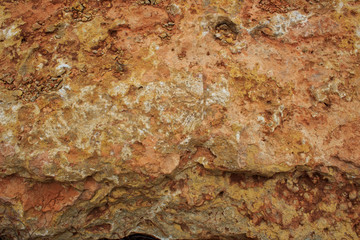  Rock, layeres structure, warm brown, yellow, red shades.