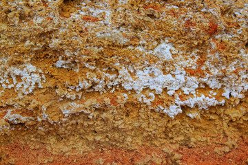  Rock, layeres structure, warm brown, yellow, red shades.