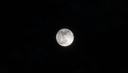 Obraz na płótnie Canvas Moon through the clouds at night, super moon