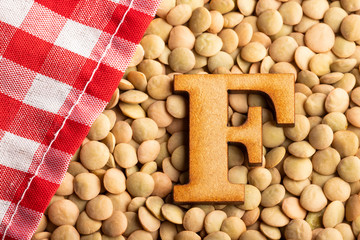 Letter F, Lentils with checkered napkin - Top view