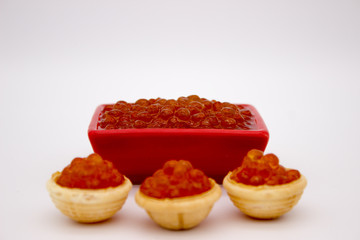 Luxury Red Caviar in the bowl. Food photo concept.