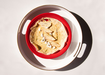 Savory apple goat cheese crepe on red plate