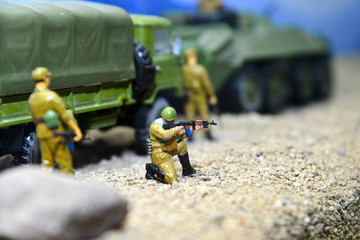 Fighting in a toy form, soldiers and military equipment, a war simulator.