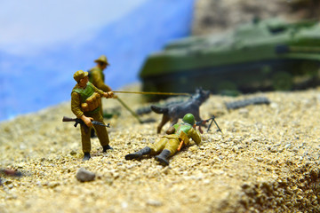 Fighting in a toy form, soldiers and military equipment, a war simulator.
