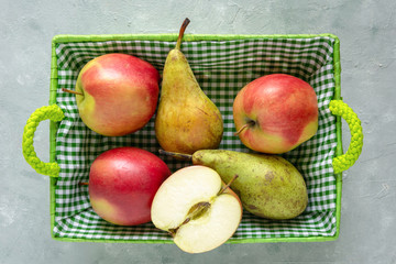 Fresh apples and pears in basket. Healthy fruits. Diet concept.