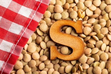 Letter S, Lentils with checkered napkin - Top view