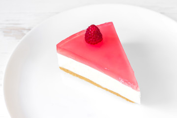 A slice of jelly cake with cottage cheese. Homemade baking. Jelly curd cake. Cheesecake.