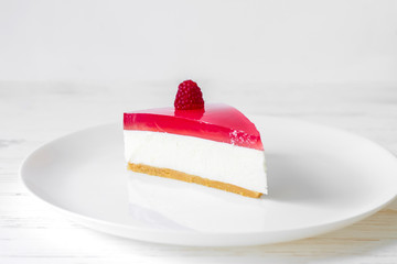 A slice of jelly cake with cottage cheese. Homemade baking. Jelly curd cake. Cheesecake.