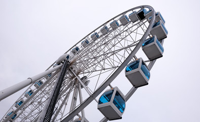 Ferris wheel with blue cabins