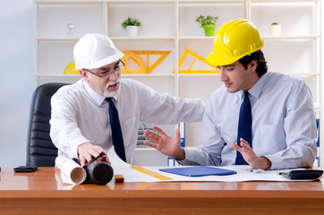 Two engineers colleagues working under project 