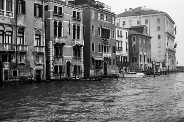 Venice / Italy 19 february 2019 :Snapshot of the houses by the canal,photo taken from vaporetto the traditional transportation of venice for the public - obrazy, fototapety, plakaty