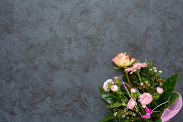 Festive flower composition on black background. Copy space