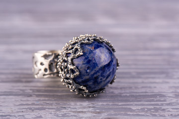 A silver ring with natural azurite in the form of a sphere