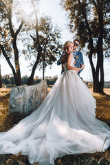 Wedding photo.Nice long dress.Blurred bride and groom in the background