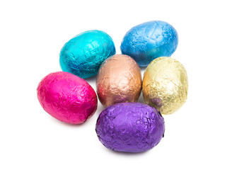 chocolate eggs in color foil isolated