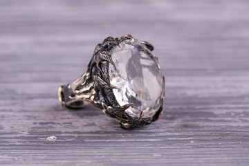 A silver ring with a cut stone from rhinestone