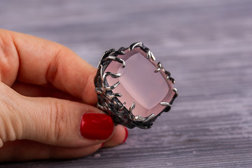 A frame with elements in the form of swallows with rose quartz