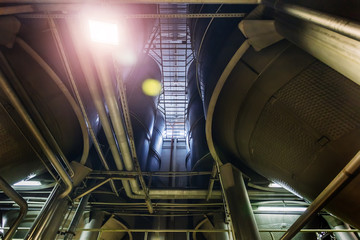 Modern brewery production line. Large vats for beer  fermentation and maturation. Bottom view
