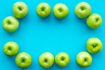 summer fruit pattern with apples on blue colorful background top view copyspace