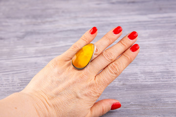 A ring with amber on a hand