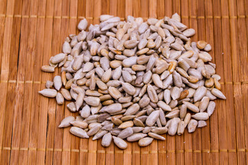 sunflower seeds on wooden background