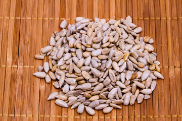 sunflower seeds on wooden background