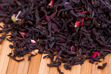black tea leaves on wooden table