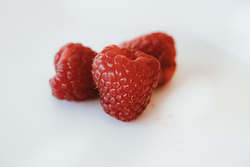 Fresh and sweet raspberries on white background. 