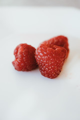 Fresh and sweet raspberries on white background. 