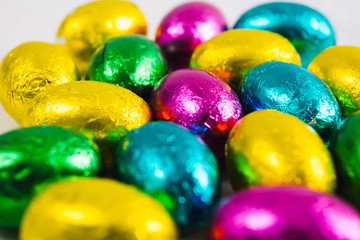 Fototapeta na wymiar Colorful chocolate Easter eggs, selective focus