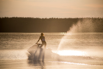 young girl riding a water scooter