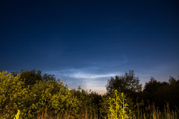 view of city at night with noctilucent clouds