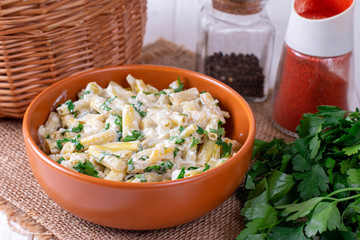 Beans in a creamy sauce on a plate on the table