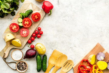 Obraz na płótnie Canvas Fresh food ingredients for vegetarian kitchen on white stone background top view mock-up