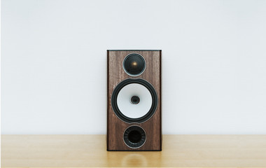 speaker on a wooden table with copyspace, white background