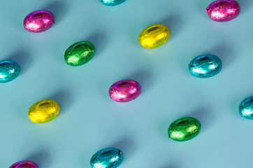 Easter greeting card with traditional colorful chocolate easter eggs