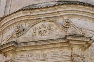 A baroque facade over the door one of the churches in the historial center of Matera town, Basilicata, Italy. UNESCO World Heritage Site. European capital of culture 2019