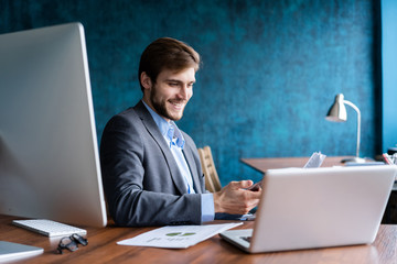 Business man working at office with laptop and documents on his desk, consultant lawyer concept.