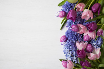 Easter background with flowers tulips and hyacinths, eggs