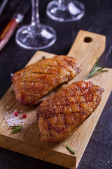Duck breast, lavender honey and rosemary, served on chopping board