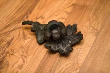 Vintage copper oak leaf candlestick on desk