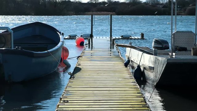 Hornsea Mere (Largest Freshwater Lake in Yorkshire) in 4k - on the morning of a bright but cold windy day - March 2019, East Yorkshire, UK