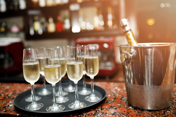 Many glasses of champagne on the table in the restaurant.