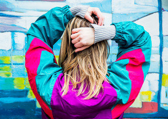 Young woman in jacket of 90s style