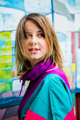 Young woman in jacket of 90s style