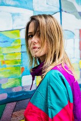 Young woman in jacket of 90s style