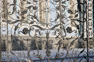 Openwork cast-iron gate of a Christian temple in the city of Voronezh (Russia)
