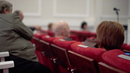 Defense of doctoral dissertation. The board members sit in the conference room.
