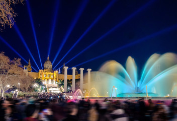 The famous Magic Fountain light show at night. Plaza Espanya in Barcelona, Spain