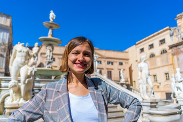 handsome tourist girl in piazza pretoria, Palermo, Sicily, Italy